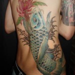 blue ink koi and flower tattoo on back1 150x150 - 100's of Koi Tattoo Design Ideas Picture Gallery