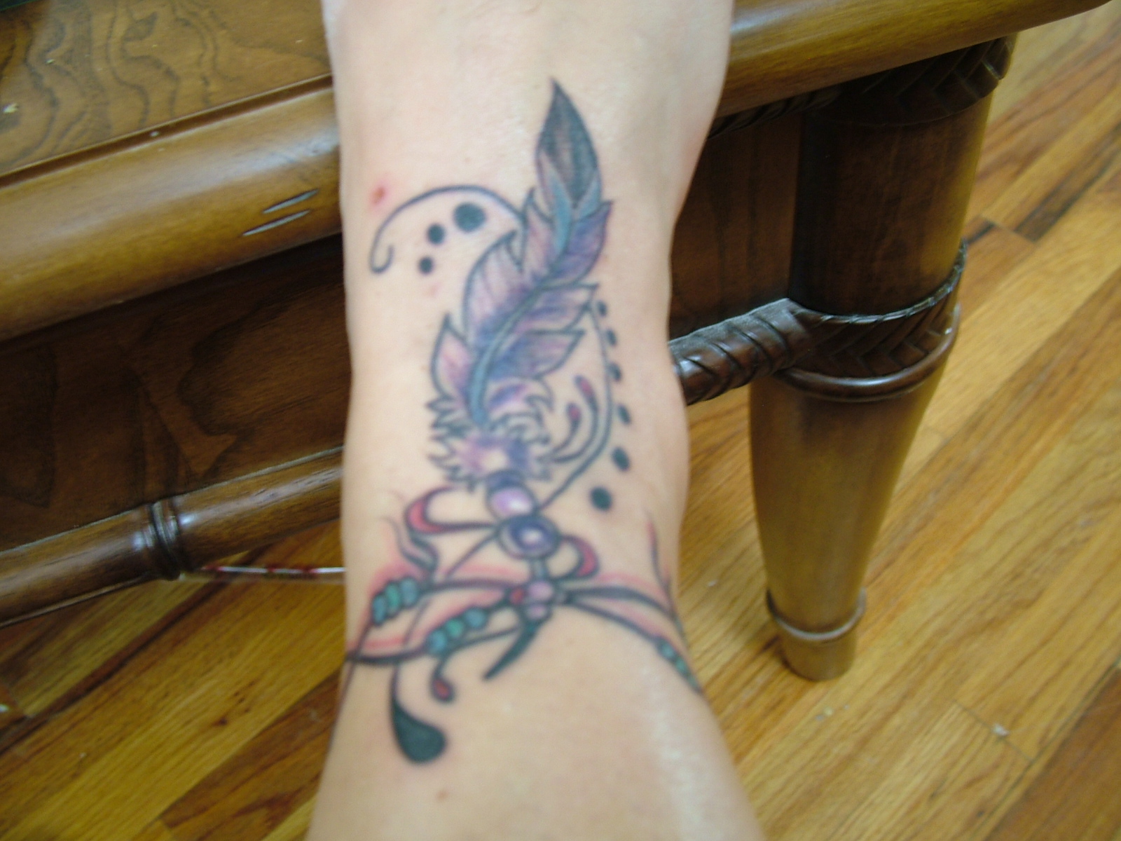 feather-tattoo-design-on-ankle